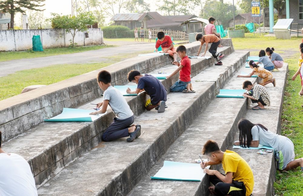 Children are seen taking part in the drawing competition organised by NEPED as part of the FPA activities in Tuensang and Peren districts.